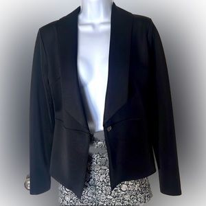 Black blazer with stretch material through out. Comfortable but sleek. Size 4